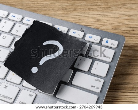 Technical Support Question Concept with Question Mark on Computer Keyboard for Online Help and Troubleshooting