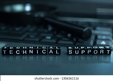 Technical Support text wooden blocks in laptop background. Business and technology concept - Shutterstock ID 1306361116