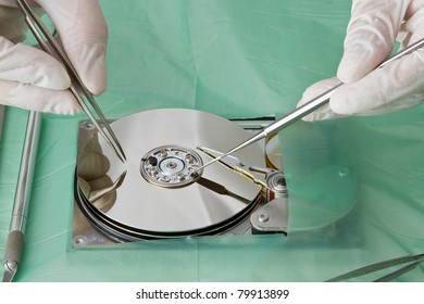 Technical Surgeon Working On Hard Drive - Data Recovery Concept