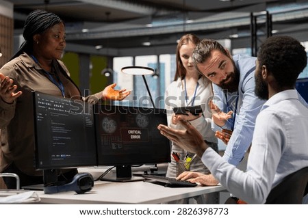 Technical team resolves a critical error popup and troubleshoots a glitch notification on an office computer