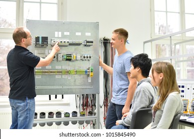 Technical Vocational Training In Industry: Young Apprentices And Trainers In The Classroom 