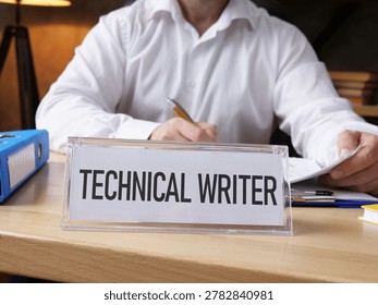 Technical Writer working on documentation in modern office, creating user manuals, software guides and digital content for technology products