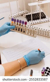 Technician analyzing blood samples in a lab with detailed documentation for medical research. High quality photo