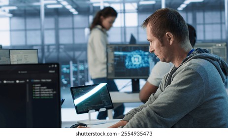 Technician arriving at work in high tech server room, analyzing data on monitors, ensuring seamless data flow. Man starting job shift in data center, ensuring system integrity and security, camera A - Powered by Shutterstock