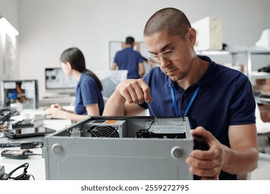 Technician Assembling Computer Hardware in Technology Lab