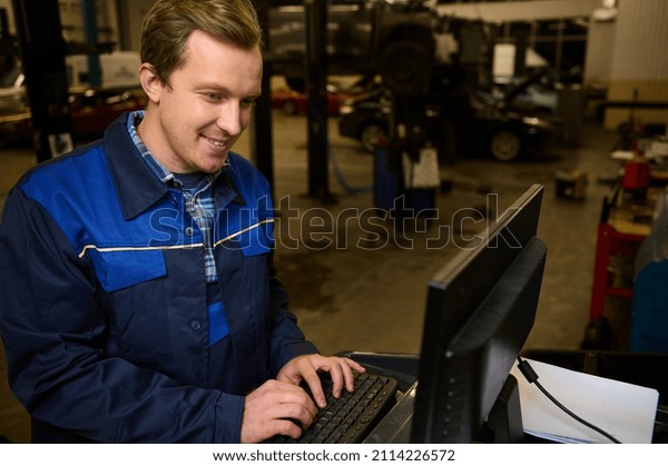 A technician, car engineer, garage mechanic\
typing on keyboard, making checklist for repairing cars, conducting\
diagnostic check of a car during regular warranty maintenance in\
auto service