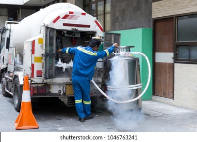 Technician With Car Nitrogen And Fill Liquid Nitrogen In Storage Tank