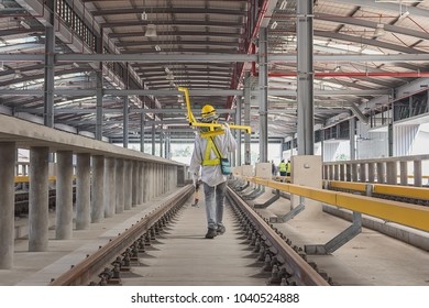 Technician Carry Measuring Gauge For Measure Track Gauge Or Distance Between Running With Conductor Rail For Make Sure Distance Comply With Criteria On Viaduct Of Sky Train.