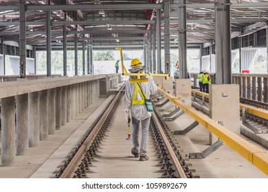 Technician Carry Measuring Gauge For Measure Track Gauge Or Distance Between Running With Conductor Rail For Make Sure Distance Comply With Criteria On Viaduct Of Sky Train.