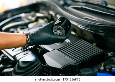 Technician Change Car Oil Filter, Automotive Spare Part. Car Maintenance Concept.