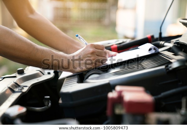 Technician check the engine daily, maintenance\
and repair concept