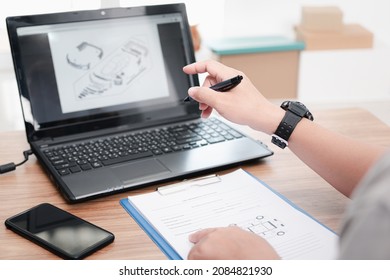 Technician check spare part manual of car in laptop and write service detail in check sheet on table in car service center office - Powered by Shutterstock