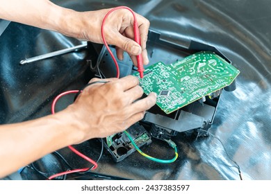 Technician checked air conditioning control board, Repairman fixed air conditioning systems, Technician man service repair and maintenance of air conditioners	 - Powered by Shutterstock