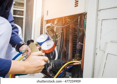 Technician is checking air conditioner