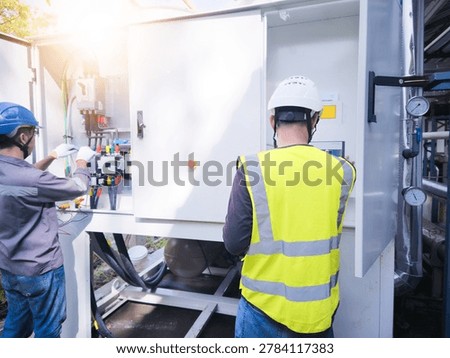 A technician is checking the commissioning of the machine before the machine is running.