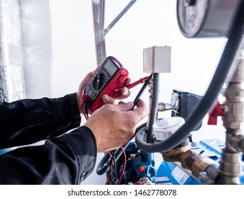 Technician Checking Water System Nodes. Industrial Background