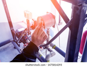 Technician Checking Water System Nodes. Industrial Background