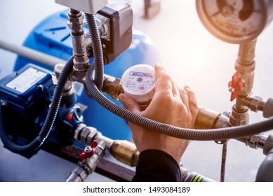 Technician Checking Water System Nodes. Industrial Background