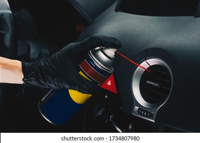 Technician Cleaning The Air Conditioning Vents With Spray. Maintenance And Repair Concept Of The Air Conditioning And Heating Piping System. Workshop Topic And Car Repairs. Automobile Dashboard.