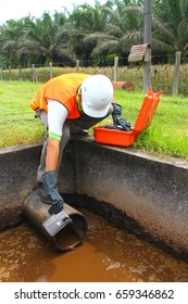 Technician Collecting Wastewater Sample