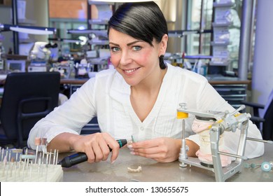 Technician In A Dental Lab Smiling