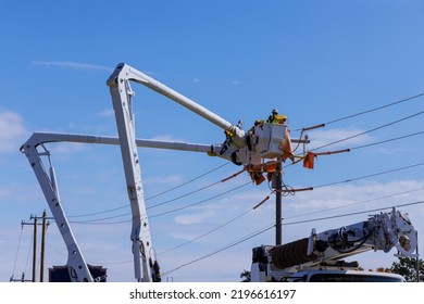 A Technician In Electrical Power Pole Maintenance Industry Has Been Hired To Repair The After Storm Damaged Power Lines.