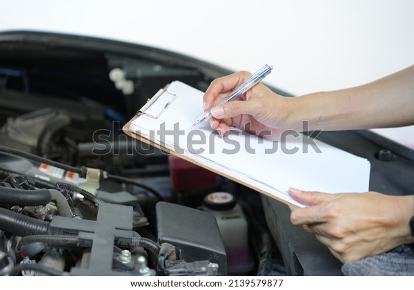Technician engineer check the engine car daily,\
maintenance and repair\
concept
