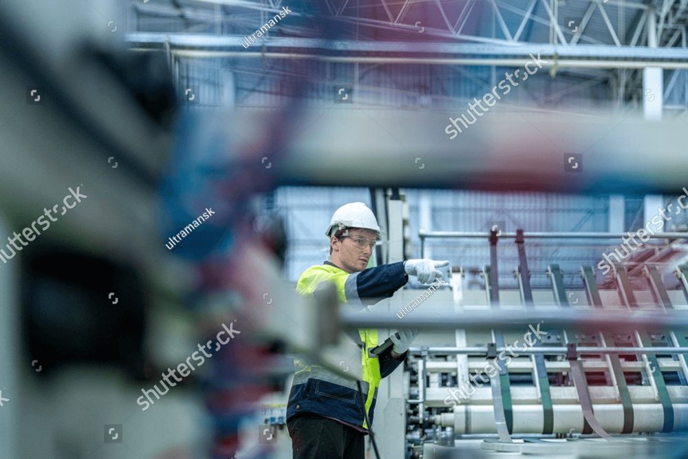 technician engineer checking process on control panel. mechanical ...