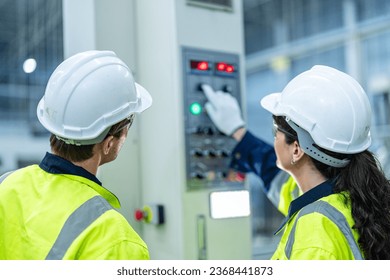 technician engineer and mentor checking process on control panel. mechanical engineering team production. Industry manufacturing men engineer worker training industry factory worker. training industry - Powered by Shutterstock