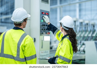 technician engineer and mentor checking process on control panel. mechanical engineering team production. Industry manufacturing men engineer worker training industry factory worker. training industry