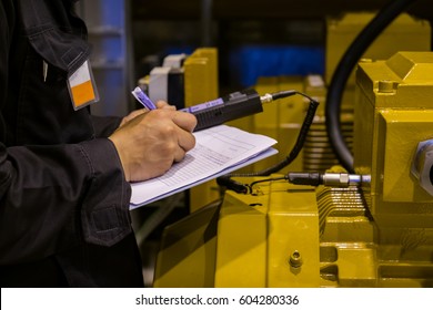 Technician Or Engineer Recording Data Vibration Measurement Of Motor Or Equipment In Power Plant