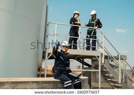 Technician and Engineer Working on a Windmill Turbine in the Field, Harnessing Renewable Energy for Sustainable Power Generation, Using Advanced Technology and Innovation to Support the Environmental