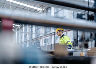 technician engineers checking the process on Heavy machine. mechanical engineering team production. Industry manufacturing. Worker holding tablet and folde. High technology production.