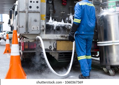 Technician Fill With Liquid Nitrogen With Nitrogen Storage Tank From A Van