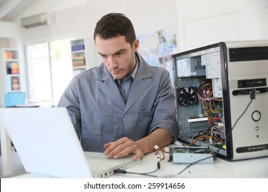 Technician Fixing Computer Hardware