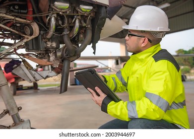 Technician Fixing The Engine Of The Airplane,Female Aerospace Engineering Checking Aircraft Engines,Asian Mechanic Maintenance Inspects Plane Engine