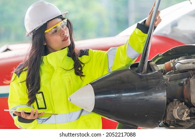 Technician Fixing The Engine Of The Airplane,Female Aerospace Engineering Checking Aircraft Engines,Asian Mechanic Maintenance Inspects Plane Engine