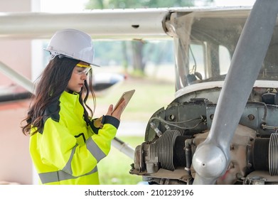 Technician Fixing The Engine Of The Airplane,Female Aerospace Engineering Checking Aircraft Engines,Asian Mechanic Maintenance Inspects Plane Engine