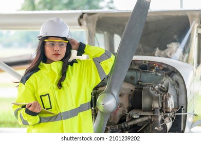 Technician Fixing The Engine Of The Airplane,Female Aerospace Engineering Checking Aircraft Engines,Asian Mechanic Maintenance Inspects Plane Engine