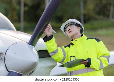 Technician Fixing The Engine Of The Airplane,Female Aerospace Engineering Checking Aircraft Engines,Asian Mechanic Maintenance Inspects Plane Engine