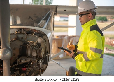 Technician Fixing The Engine Of The Airplane,Female Aerospace Engineering Checking Aircraft Engines,Asian Mechanic Maintenance Inspects Plane Engine