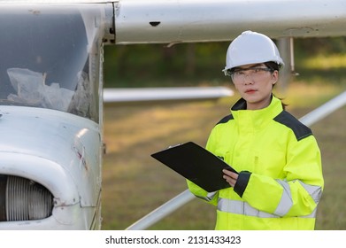 Technician Fixing The Engine Of The Airplane,Female Aerospace Engineering Checking Aircraft Engines,Asian Mechanic Maintenance Inspects Plane Engine