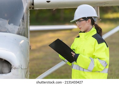 Technician Fixing The Engine Of The Airplane,Female Aerospace Engineering Checking Aircraft Engines,Asian Mechanic Maintenance Inspects Plane Engine