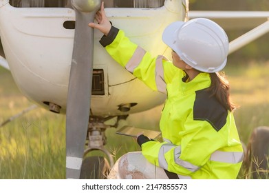 Technician Fixing The Engine Of The Airplane,Female Aerospace Engineering Checking Aircraft Engines,Asian Mechanic Maintenance Inspects Plane Engine