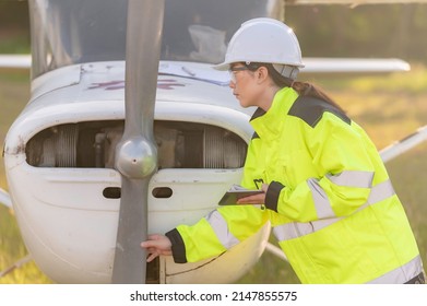 Technician Fixing The Engine Of The Airplane,Female Aerospace Engineering Checking Aircraft Engines,Asian Mechanic Maintenance Inspects Plane Engine