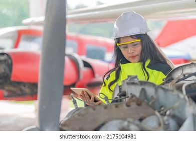 Technician Fixing The Engine Of The Airplane,Female Aerospace Engineering Checking Aircraft Engines,Asian Mechanic Maintenance Inspects Plane Engine