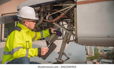 Technician fixing the engine of the airplane,Female aerospace engineering checking aircraft engines,Asian mechanic maintenance inspects plane engine - Powered by Shutterstock