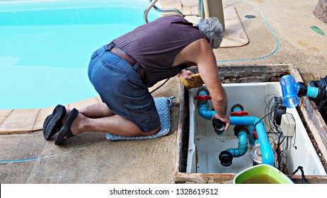 Technician Fixing Swimming Pool Water Pump. Service And Maintenance For Swimming Pool.