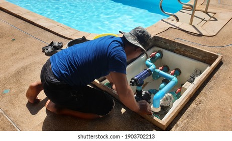 Technician Fixing Swimming Pool Water Pump. Service And Maintenance For Swimming Pool.