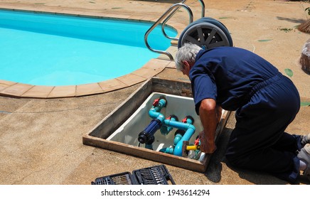 Technician Fixing Swimming Pool Water Pump. Service And Maintenance For Swimming Pool.        